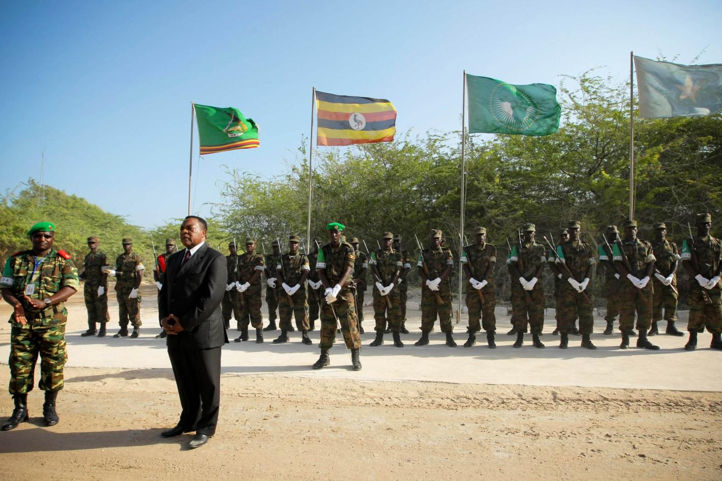 Augustine Mahiga (front, right), Special Representative of the Secretary-General and Head of the UN Political Office for Somalia (UNPOS), addresses troops and officers from the African Union Mission in Somalia (AMISOM) following his arrival in Mogadishu.